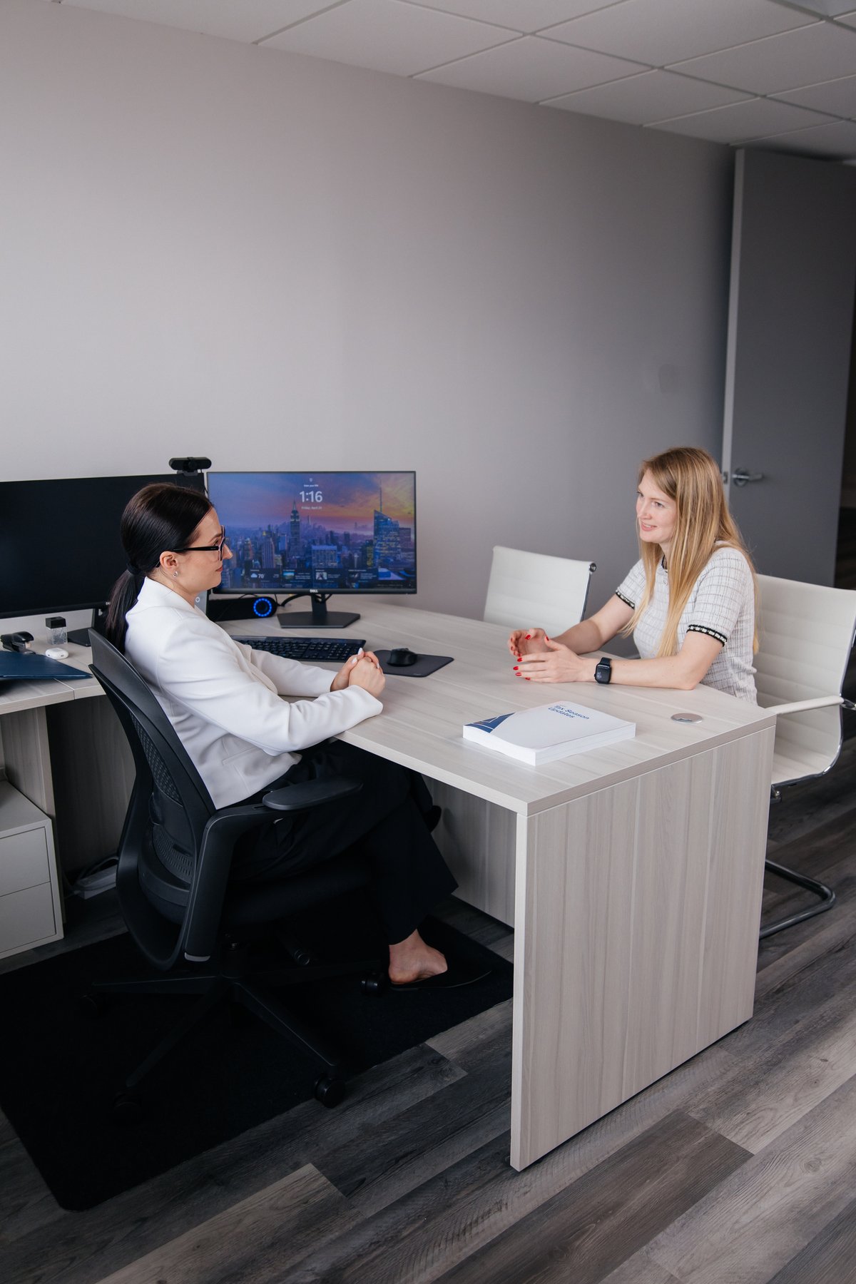 Iryna advising a client in the office